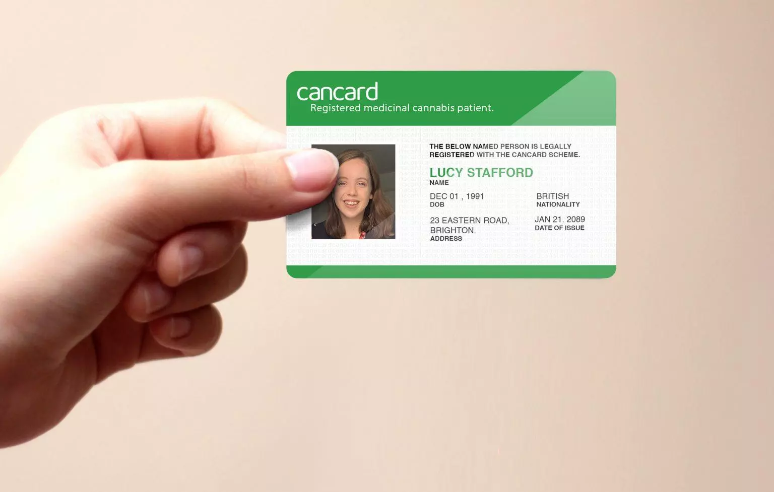 A hand holding a Cancard.