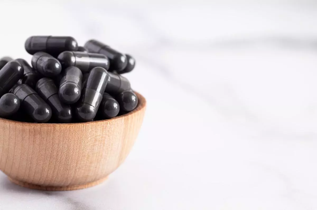 A bowl full of activated charcoal capsules.