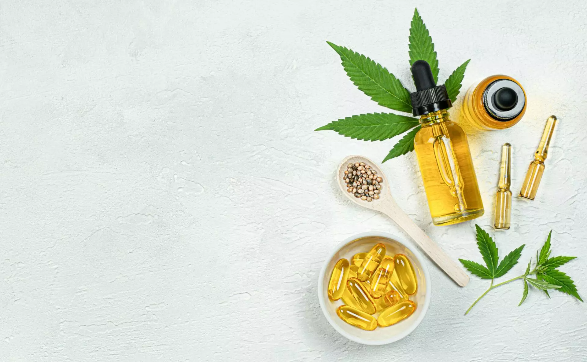 A picture of medical cannabis in different forms from oils to pills, plants and grain.